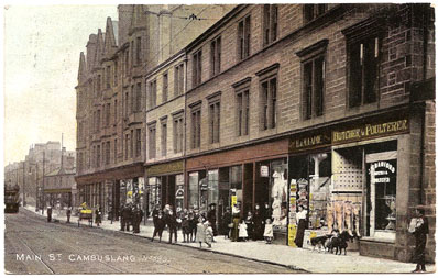 Main Street - Circa 1904 - 2nd shop on the right is H & W Eadie, Stationers, Publisher of this 'Old Cambuslang' Post Card No 589 - Card dated 1909